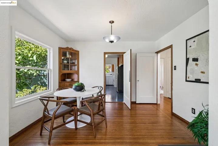 Dining room with dark wood-style floors