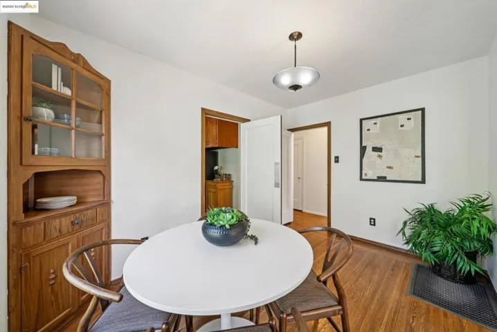 Dining room with wood finished floors and baseboards