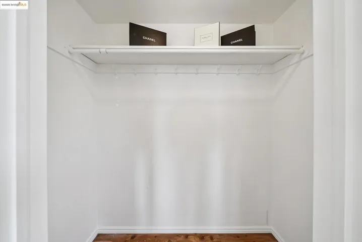 Spacious closet with wood finished floors