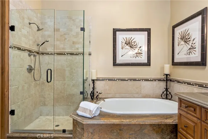 Primary en suite bathroom with sep shower & tub