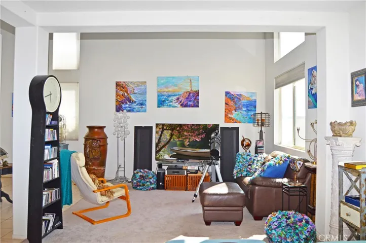 Double-Height Ceiling in the Living Room which Opens to More Living Space for an Open, Flexible Floor Plan