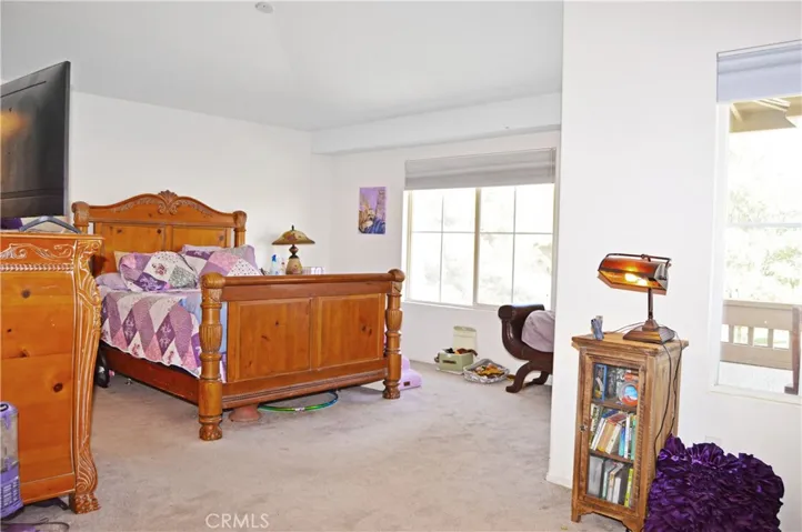 Spacious Main Bedroom Suite with Retreat Area, View Balcony, and an En Suite Bath