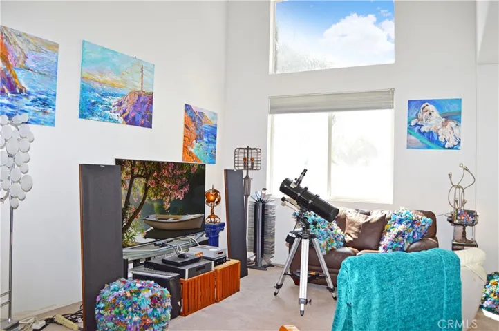 Double-Height Ceiling in the Living Room which Opens to More Living Space for an Open, Flexible Floor Plan