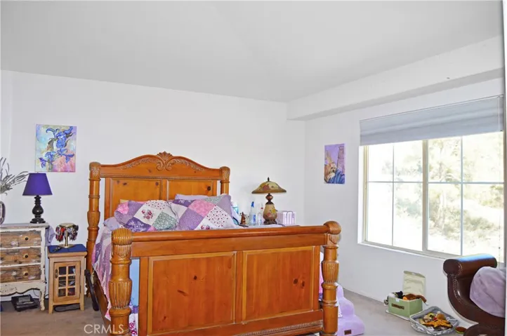Spacious Main Bedroom Suite with Retreat Area, View Balcony, and an En Suite Bath