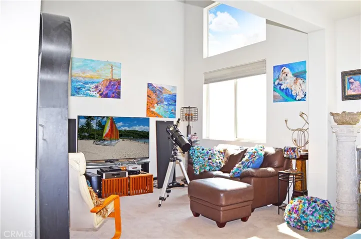 Double-Height Ceiling in the Living Room which Opens to More Living Space for an Open, Flexible Floor Plan