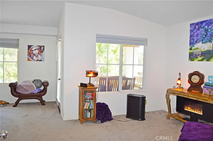 Spacious Main Bedroom Suite with Retreat Area, View Balcony, and an En Suite Bath