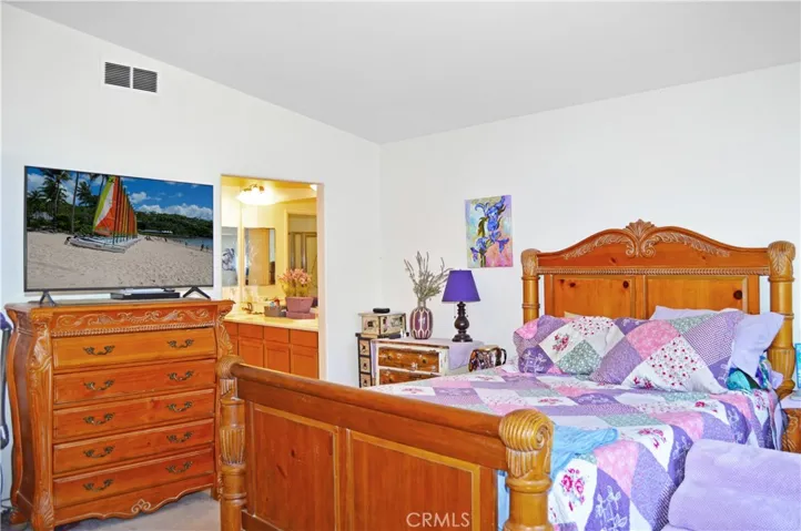 Spacious Main Bedroom Suite with Retreat Area, View Balcony, and an En Suite Bath