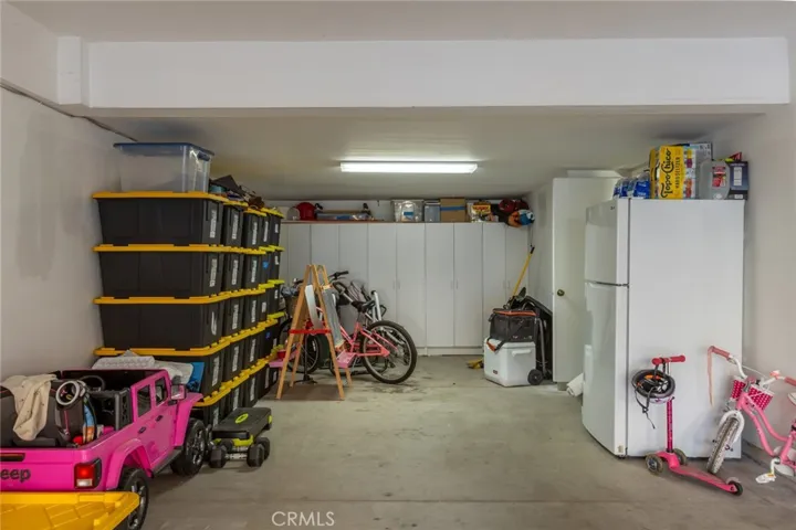 three car garage with storage room