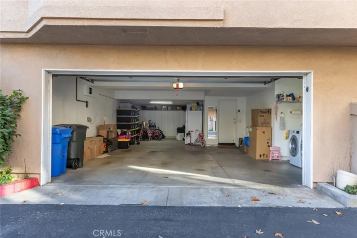 three car garage with storage room