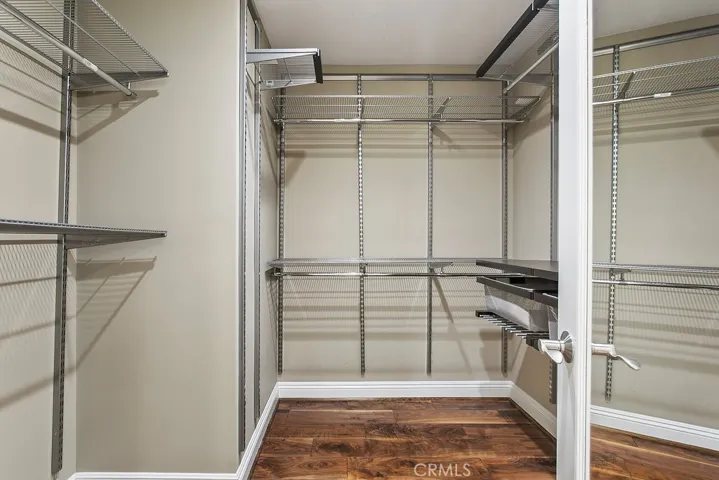 Primary bedroom walk-in closet