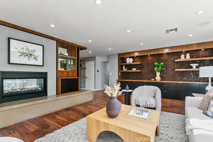 Living room with fireplace and TV option above.