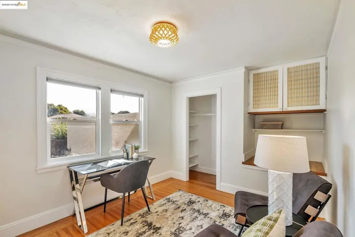 Office featuring light wood finished floors and crown molding