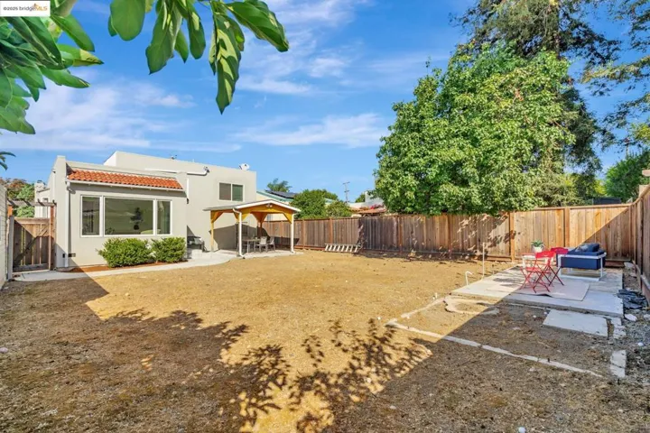 Fenced backyard featuring a patio
