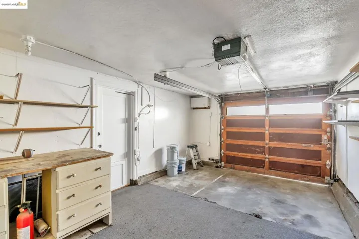 Garage featuring a garage door opener
