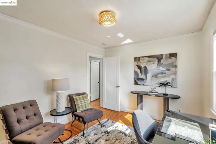 Office featuring ornamental molding and light wood-type flooring
