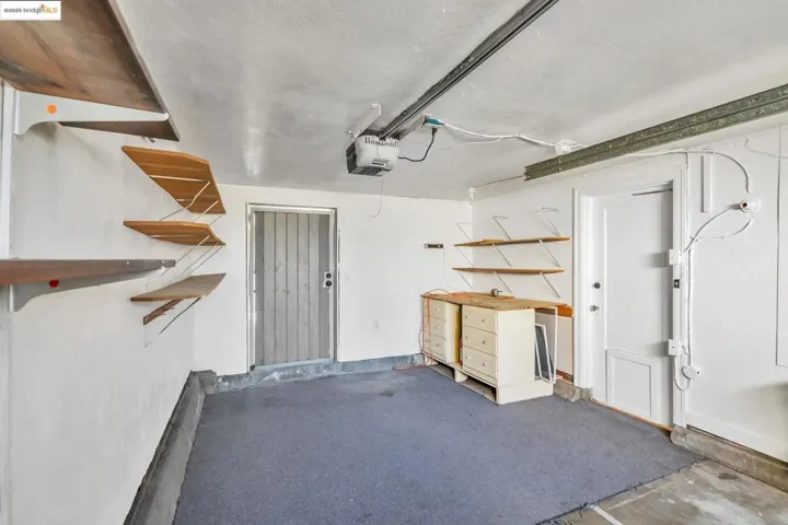 Garage featuring a garage door opener