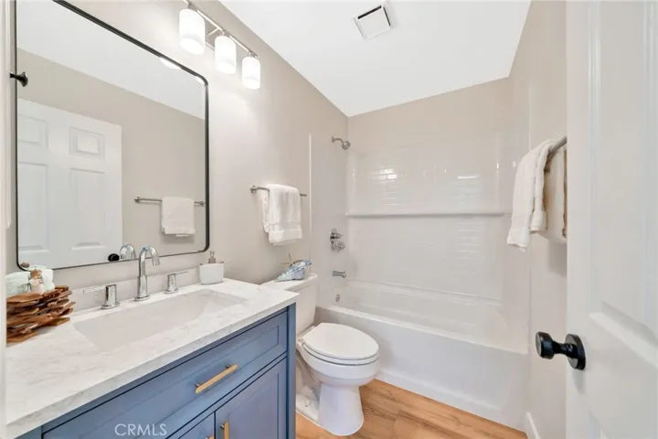 2nd floor hall bathroom - New tub & shower surround, vanity, lights, and plumbing fixtures.