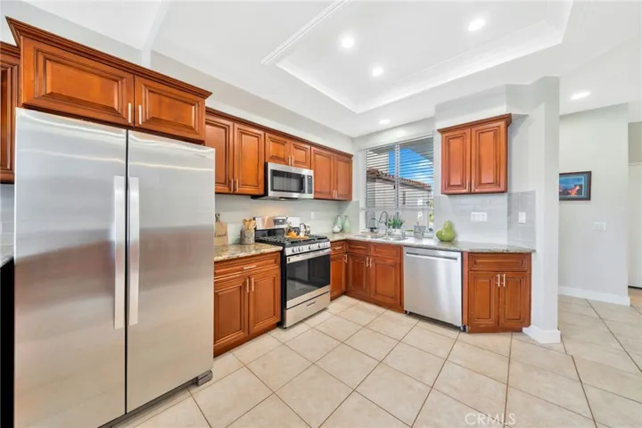 Stainless steel appliances, granite counters, recessed lighting, and plenty of cabinet space