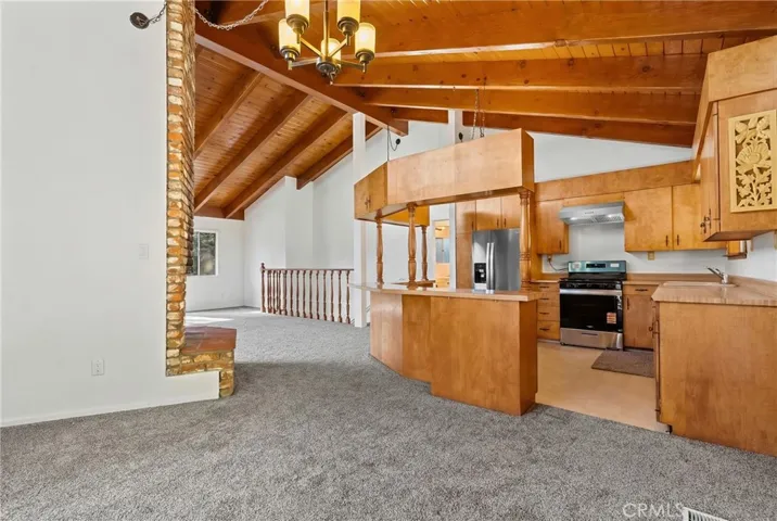 Dining room has its own sliding door to a concrete patio with access to the wrap around decking