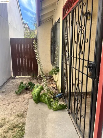 Entrance to property with a gate and stucco siding