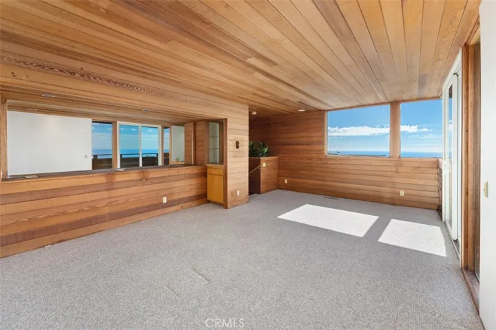 Den view of wet bar