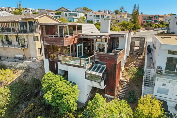 Aerial view of back of home from canyon
