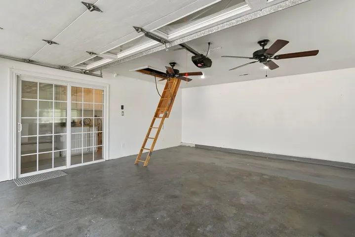garage with pull down stairs to storage