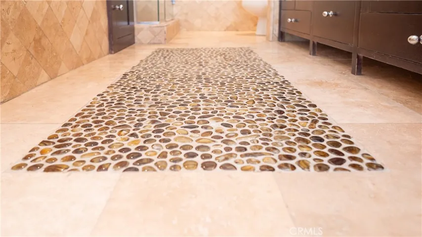 Primary Bathroom Pebble Stone Floor Tile