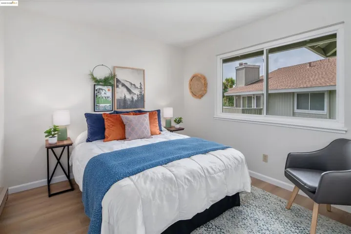 Bedroom with light wood-type flooring and baseboards