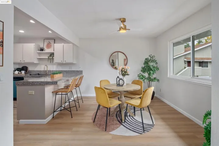Dining area with light wood-type flooring, recessed lighting, and ceiling fan