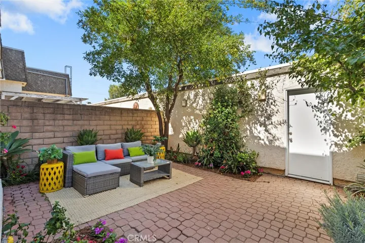 Patio located between unit and double attached garage