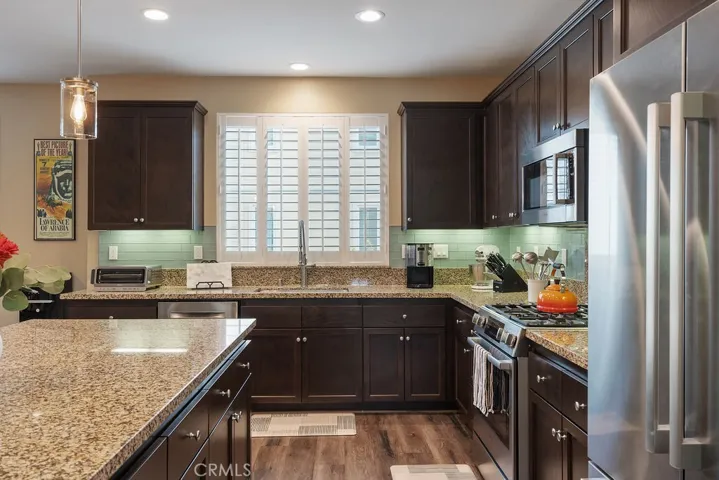 Stainless appliances, granite counters, and updated fixtures