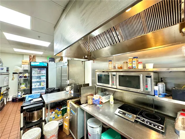 full kitchen with big hoods