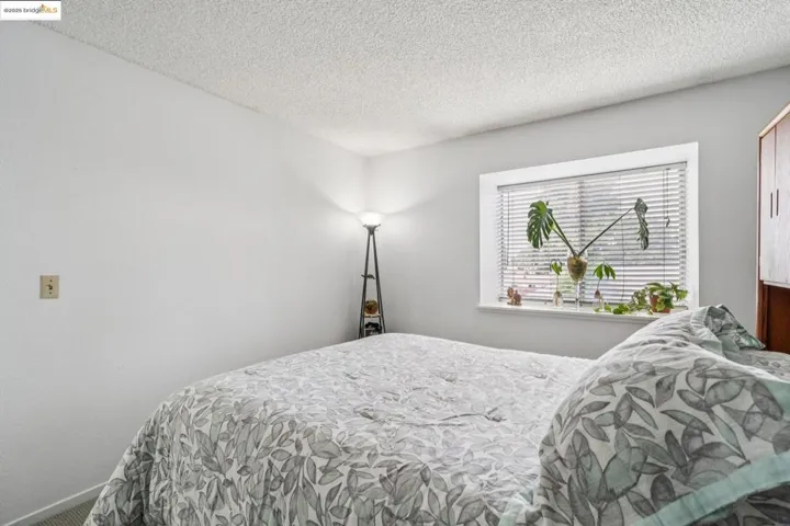 Bedroom with a textured ceiling