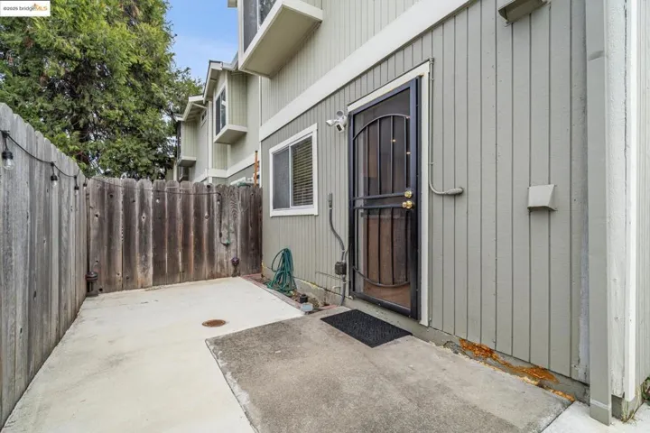 Property entrance with a patio