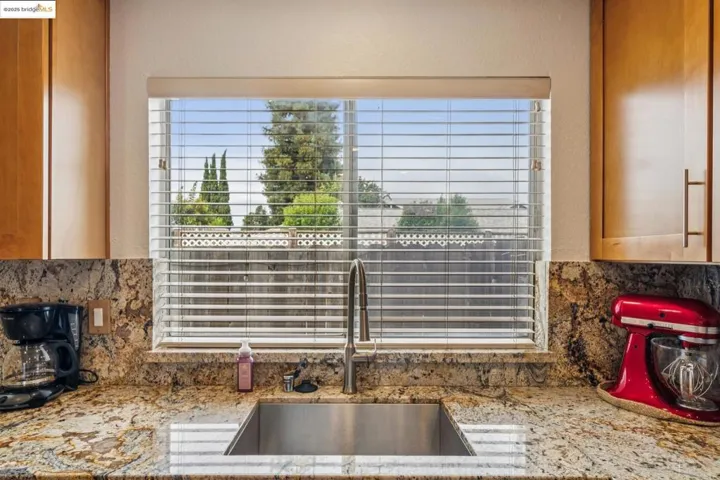 Kitchen view of backsplash and light stone counters