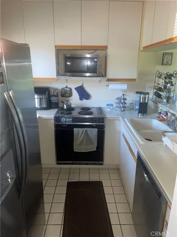 Bright and cheery kitchen with an open and airy sensation with windows and openness to the dinette and living room facing the golf course