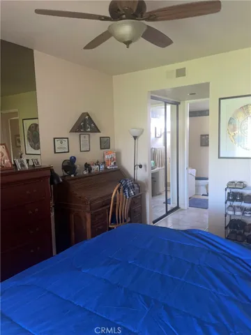 King size bedroom with ensuite bath and closets, and on the opposite direction a sliding door leading to a generous patio facing the 7th Lago golf course with the spray of a soothing lake fountain