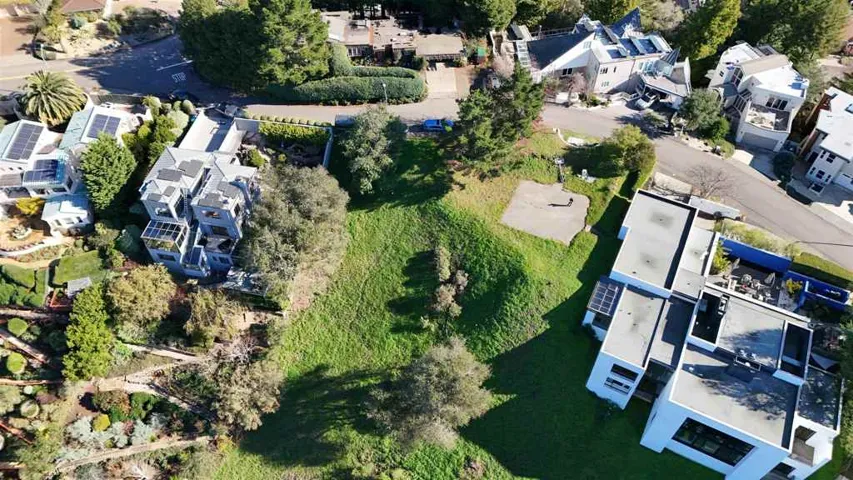 Aerial view of property's location featuring nearby suburban area
