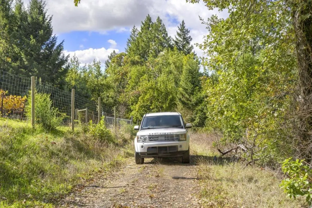 Parcel gate is approx 6 minutes from Skyline Blvd. Access is a dirt road, moderately bumpy.