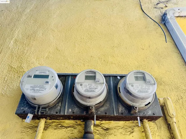 Exterior view of electric meter and stucco siding