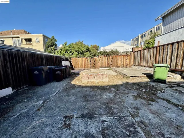 Fenced backyard featuring a patio