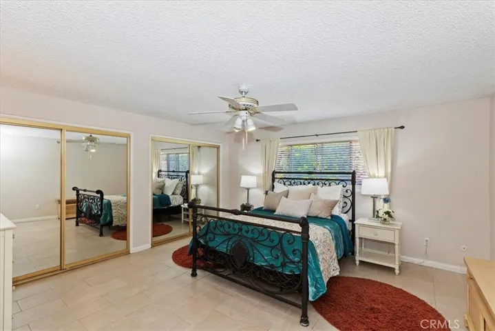 Primary oversized bedroom with double closets and with its own bathroom