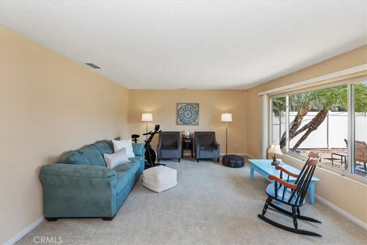 Large front room perfect space for game room, secondary family room or formal dining room.