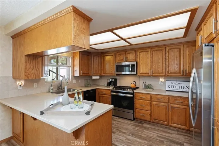 Stainless steel appliances and quartz counter tops.
