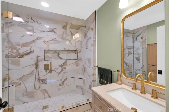 Extra large shower w cealing and wall shower heads.