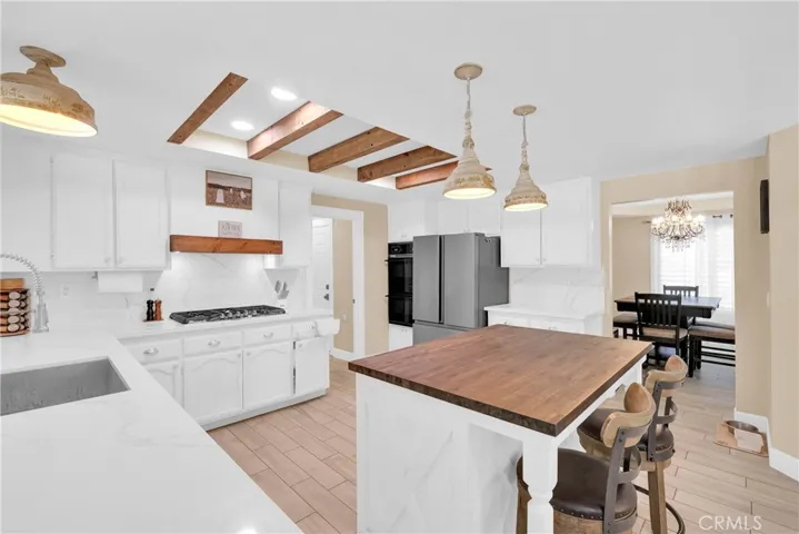 Kitchen features a beautiful butcher block island