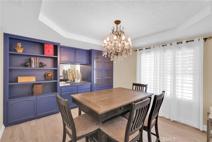 Dinning Area with built in hutch and gorgeous chandelier