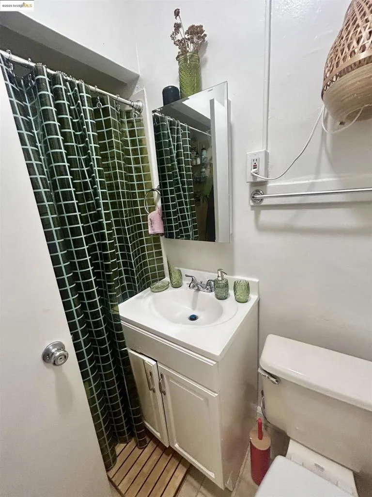 Full bath featuring vanity and a stall shower