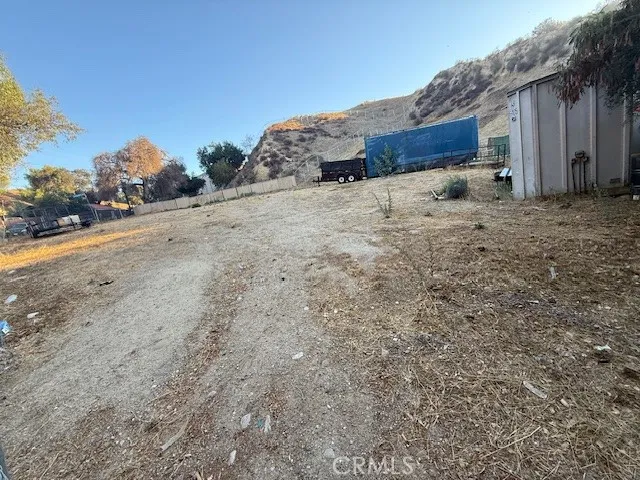 Two lots - flat as a pancake and fenced. There is a shed and storage container on them.